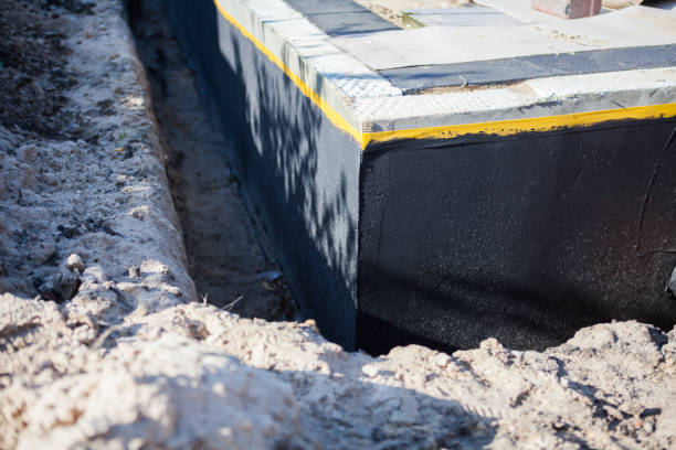 Professional Basement Waterproofing technician working in Peapack, NJ